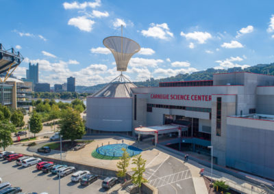 Exterior view of Carnegie Science Center and the parking lot