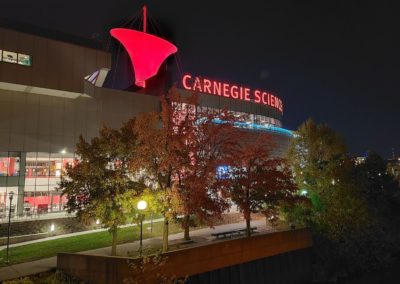 Exterior view of Carnegie Science Center at night from the USS Requin