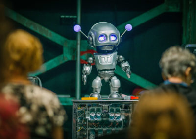 Quasi the robot in front of an audience