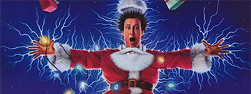 Chevy Chase dressed as Santa being electrocuted by Christmas Lights