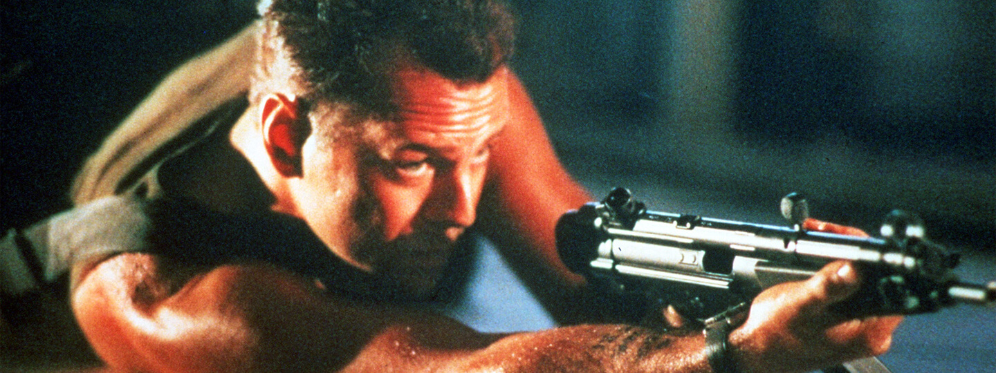 Bruce Willis aiming a gun