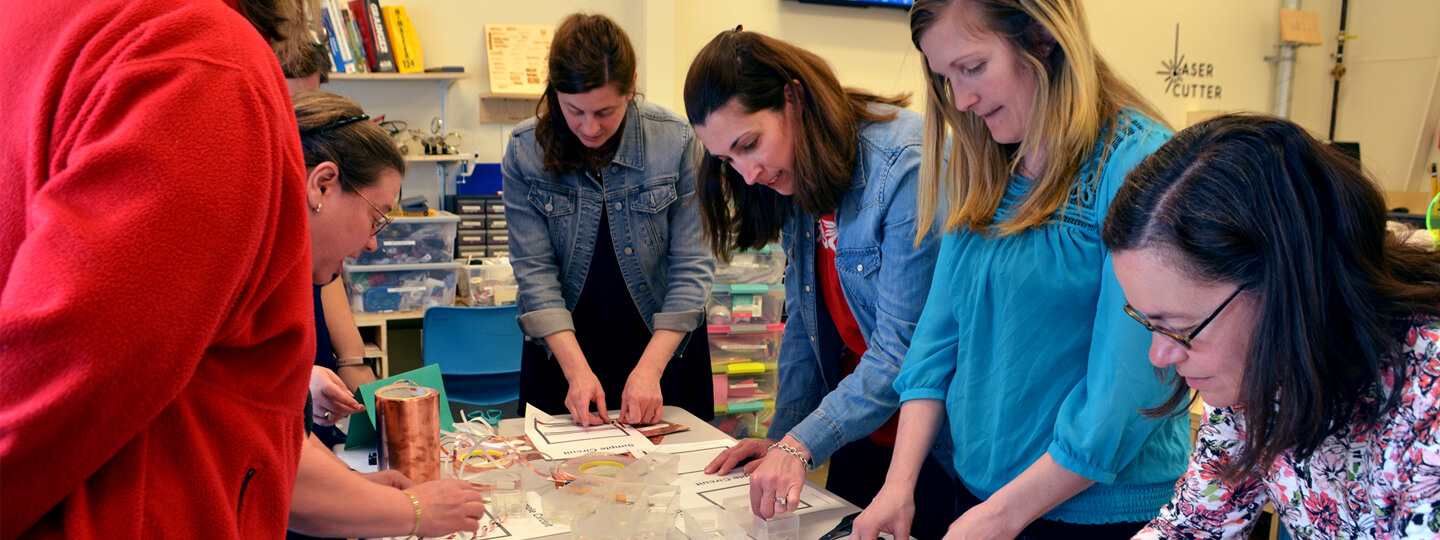 Teachers work on a circuitry activity during a Teaching Excellence Academy workshop