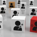 Blocks representing people who are vaccinated and one block that is infected