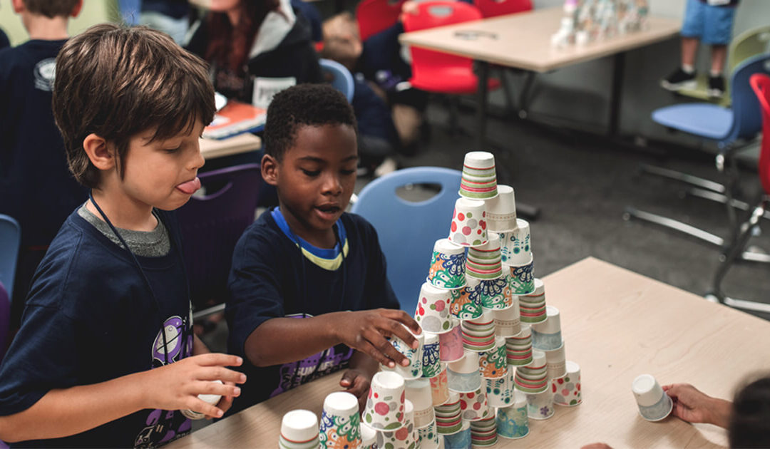 Children building towers with cups