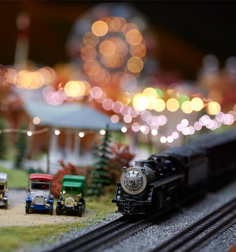 A model train going through a replica town