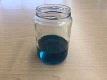 Jar with green liquid