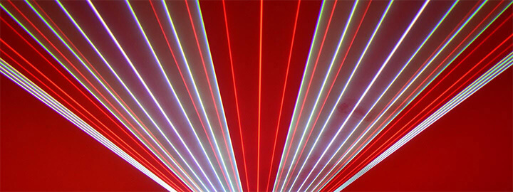 Red, white, and purple lasers fanning out from the bottom