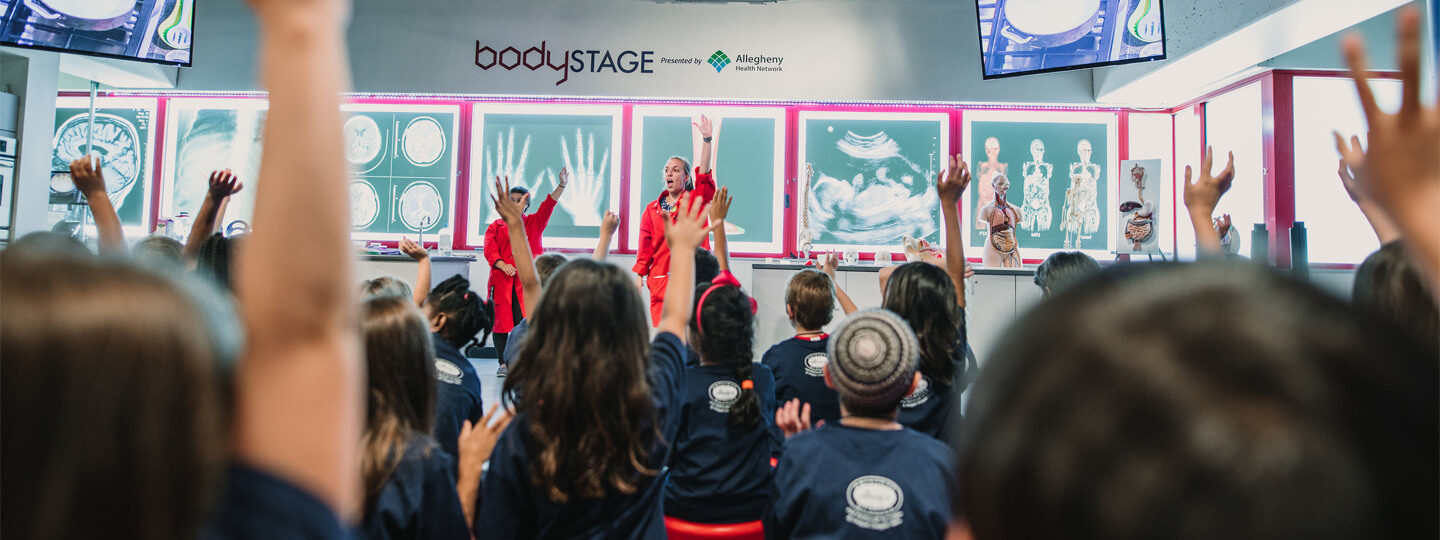 Bodystage theater with children raising their hands