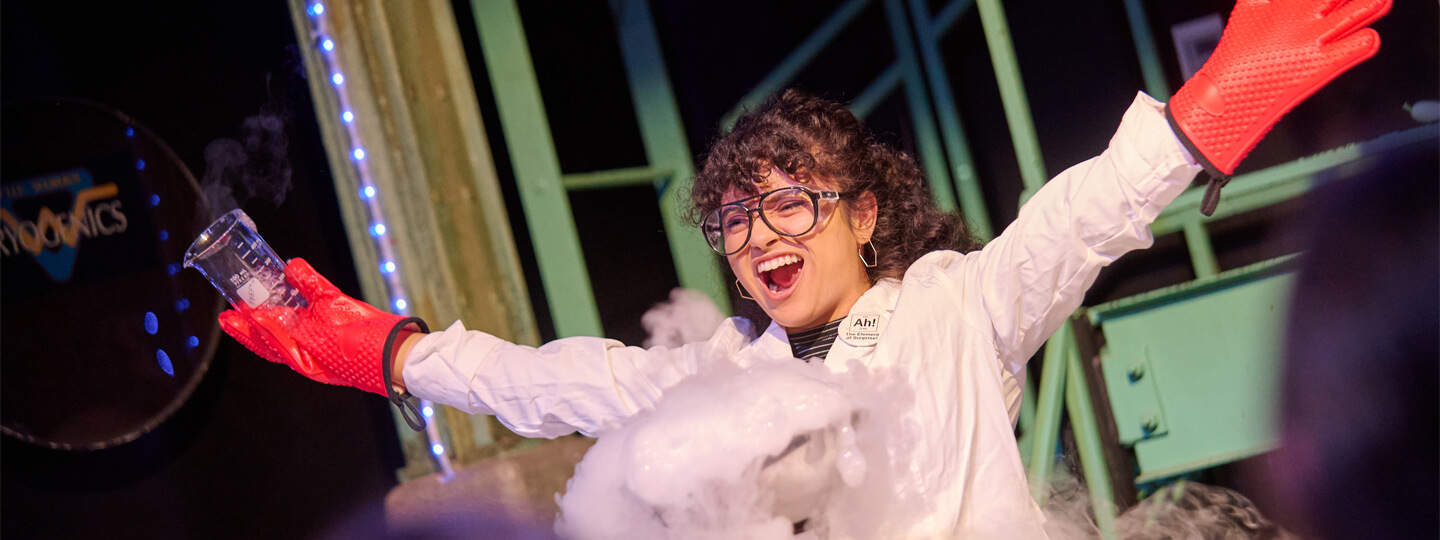 Staff educator wearing protective goggles and gloves with liquid nitrogen