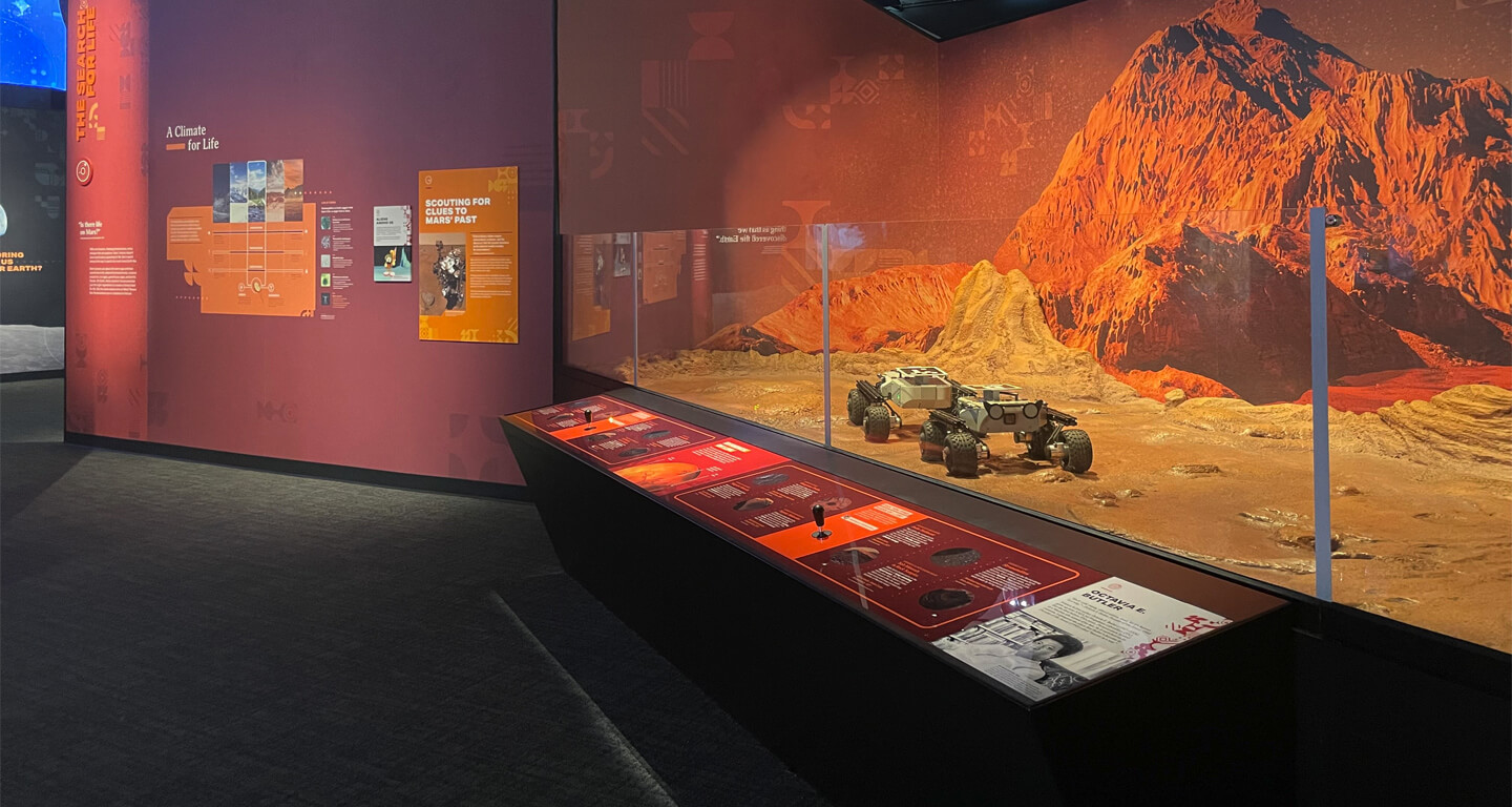 Rendering of people interacting with the Mars exhibit