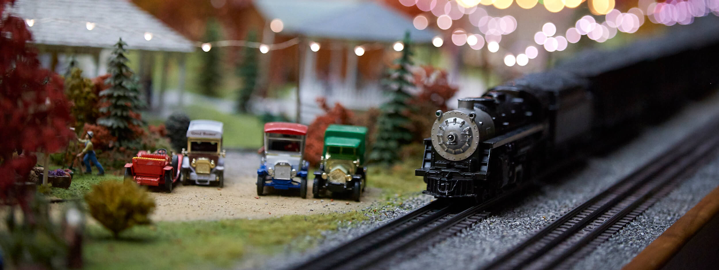 A model train going through a replica town