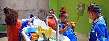 Children playing with a water table