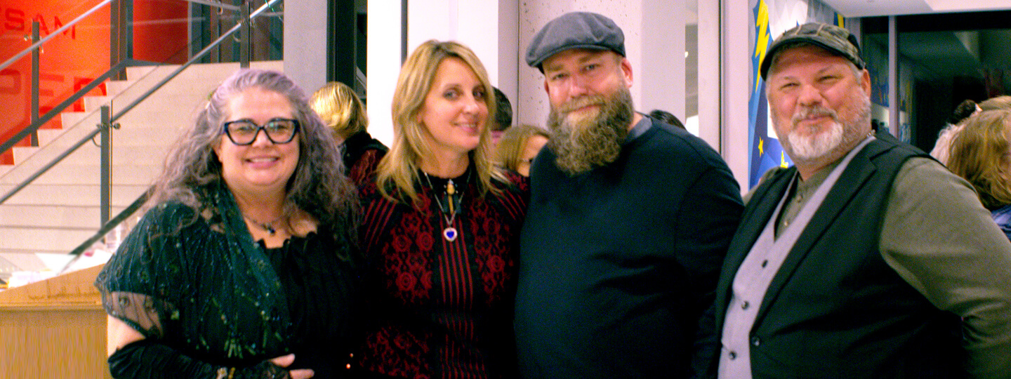 Two couples smiling