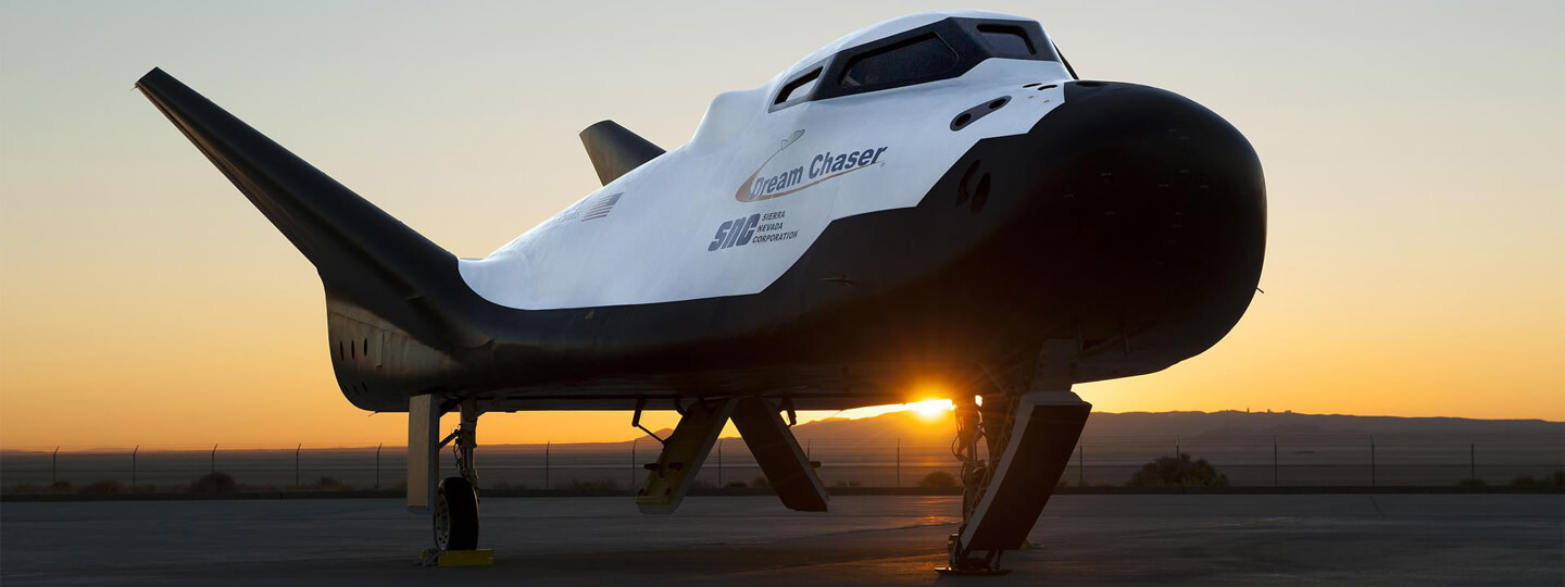 Sierra Nevada Corp’s Dream Chaser posed on ramp at sunrise at NASA Armstrong Flight Research Center in California.