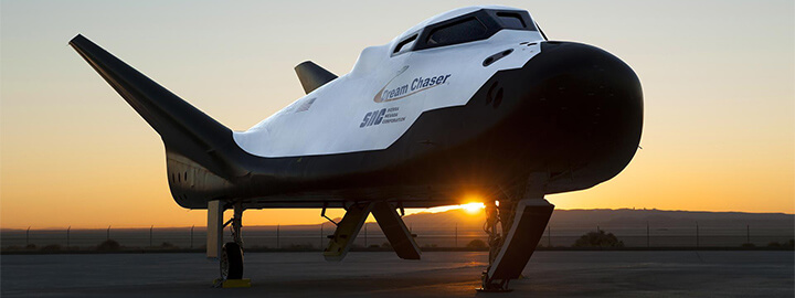 Sierra Nevada Corp’s Dream Chaser posed on ramp at sunrise at NASA Armstrong Flight Research Center in California.