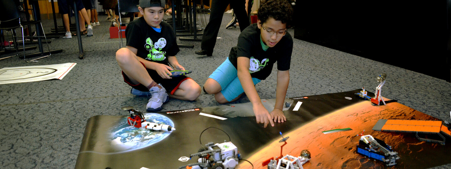 Children operating small robots