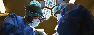 Two doctors performing surgery